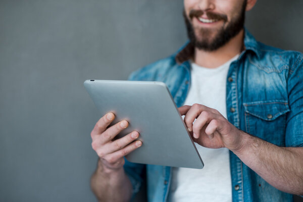 young man holding digital tablet