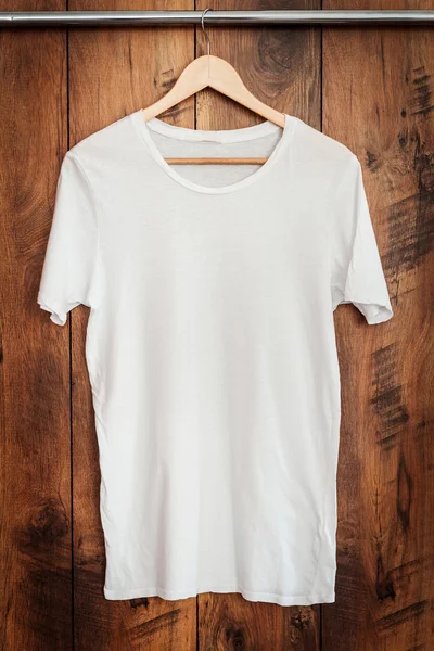 white T-shirt hanging on hanger