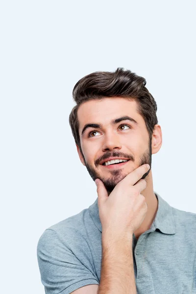 Thoughtful man holding hand on chin — Stock Photo, Image