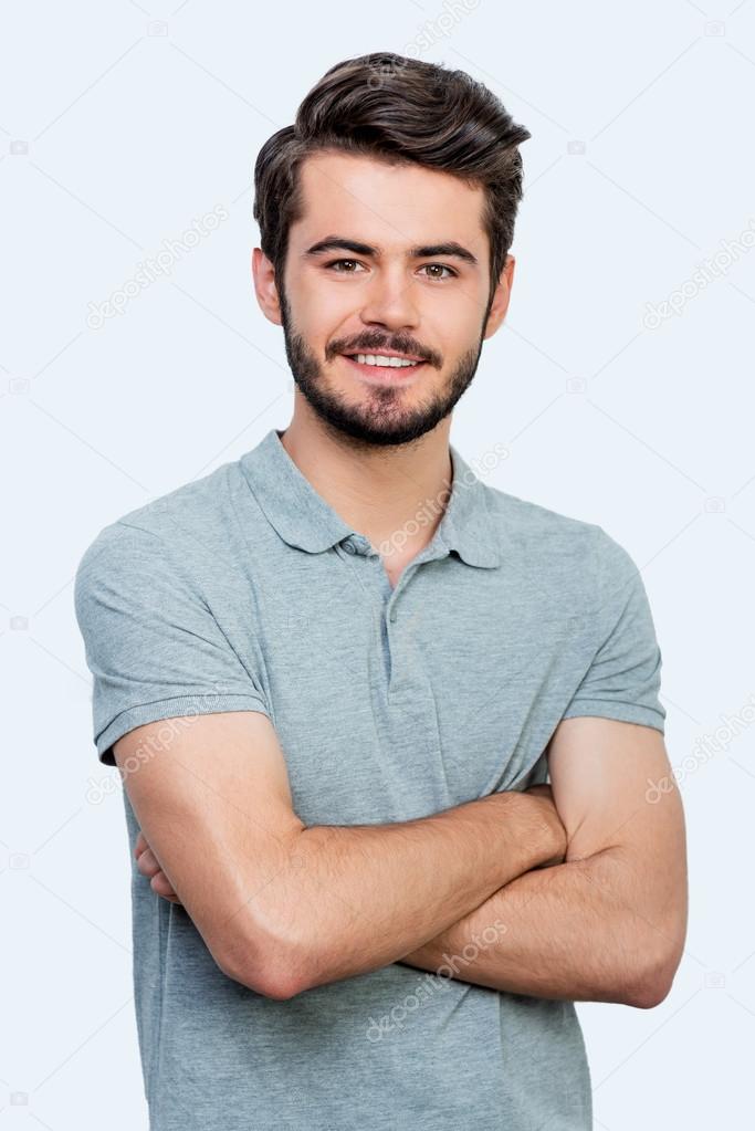 Handsome man keeping arms crossed