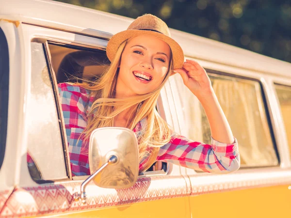 Woman looking through vehicle window — Stock Photo, Image