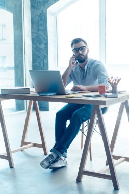 beard man talking on mobile phone