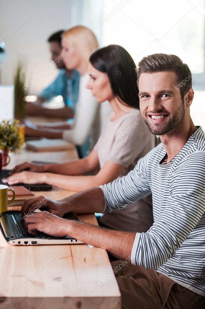 Business people working at their laptops Stock Photo by ©gstockstudio
