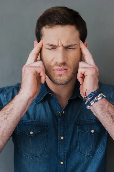 Frustrated man touching his head — Stock Photo, Image