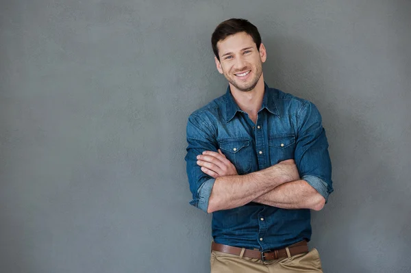 Happy man keeping arms crossed — Stock Photo, Image