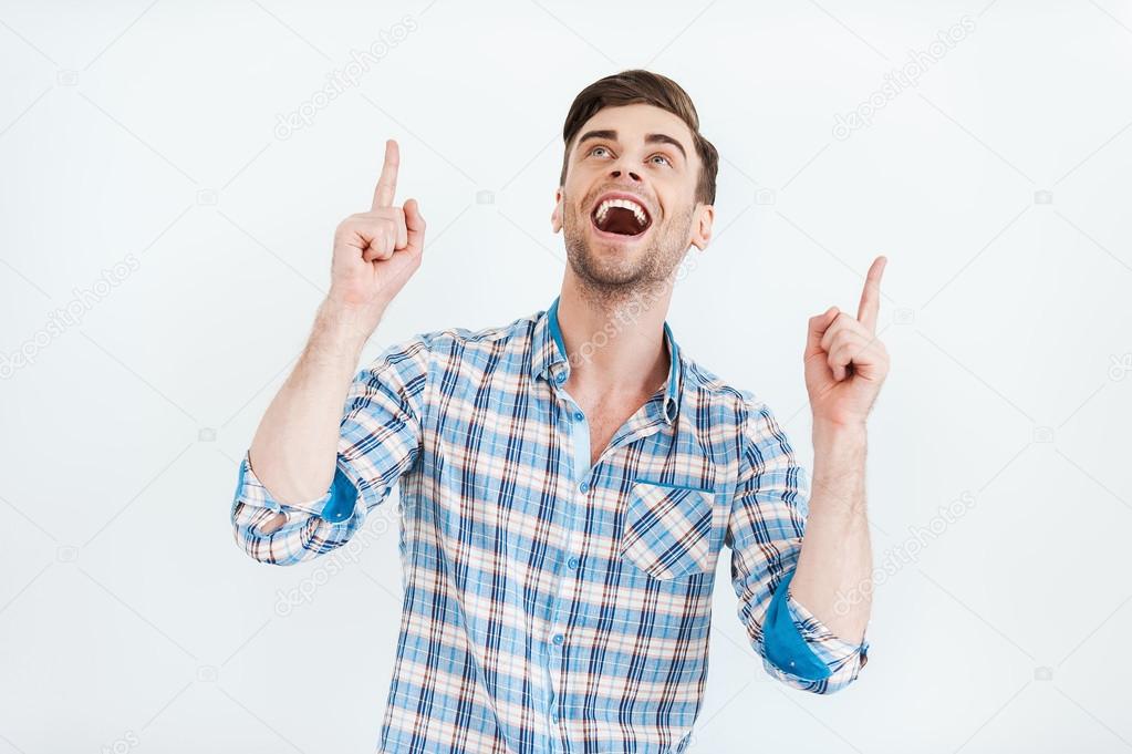 man in shirt pointing up