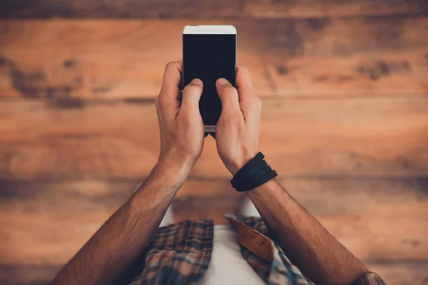 man holding smart phone