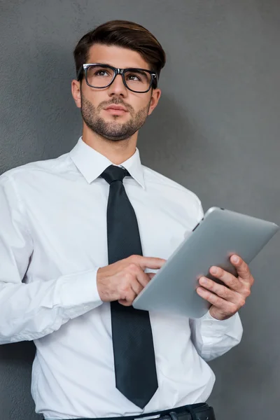 Man in shirt  holding digital tablet — Zdjęcie stockowe