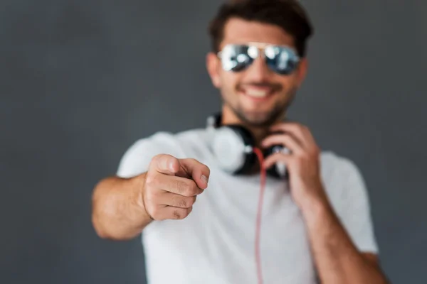 Man in headphones pointing you — Stock Photo, Image
