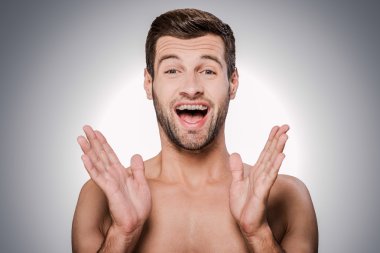 happy young shirtless man clipart
