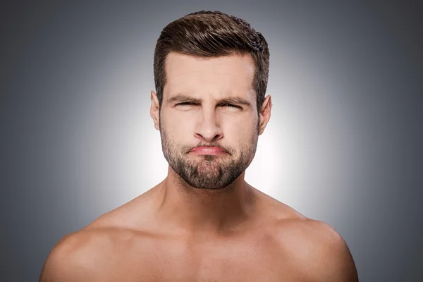 Shirtless man grimacing — Stock Photo, Image