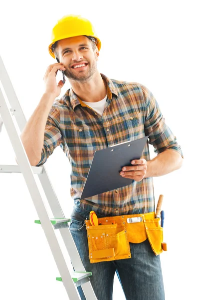 Manual worker talking on mobile phone — Stock Photo, Image