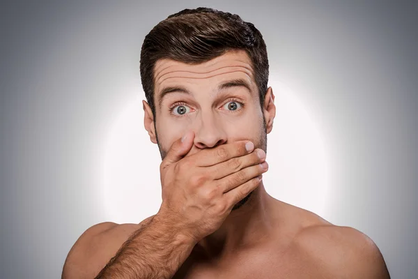 Shirtless man covering mouth by hand — Stock Photo, Image