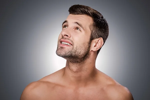 Thoughtful young shirtless man — Stock Photo, Image