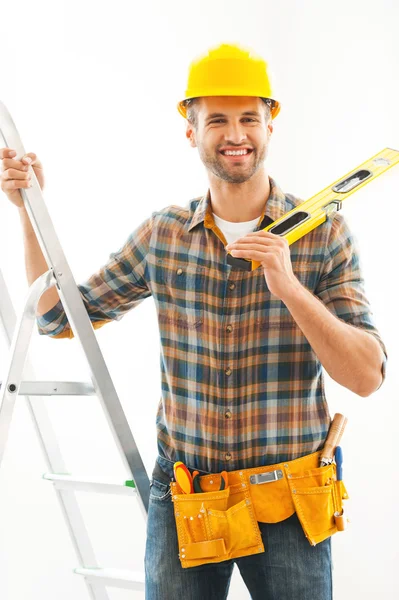 Manual worker holding hand on ladder — Stockfoto