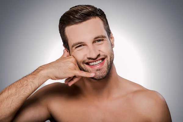 Shirtless man gesturing mobile phone — Stock Photo, Image