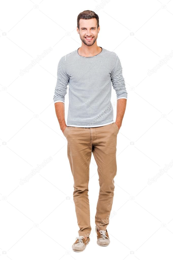 cheerful man holding hands in pockets