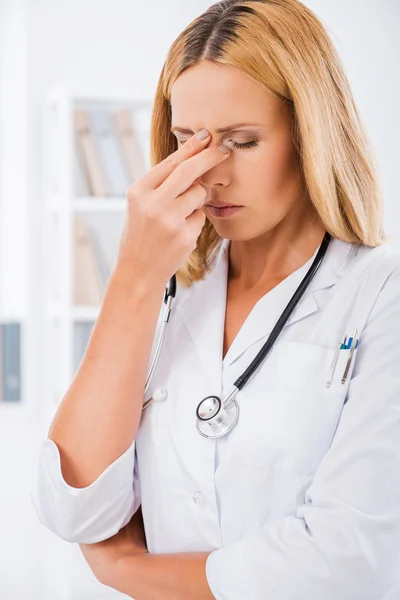 Depressed female doctor in  uniform — Stock Photo, Image