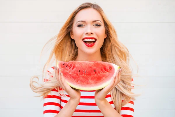 Woman holding slice of watermelon — Stock Photo, Image