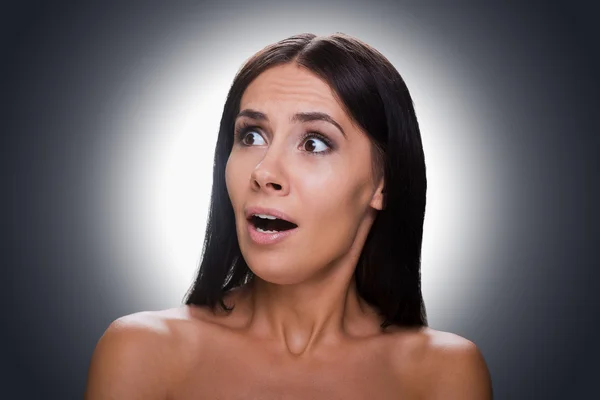Shocked young shirtless woman — Stockfoto