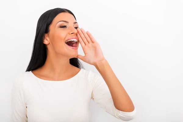 Woman holding hand near her mouth — Stock Photo, Image