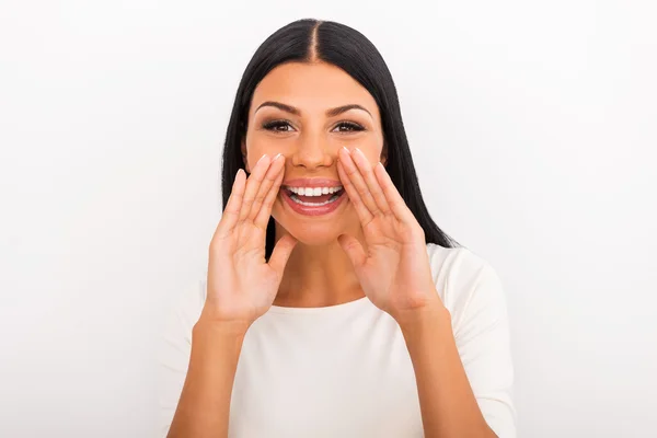 Woman holding hands near her mouth — Stock Photo, Image