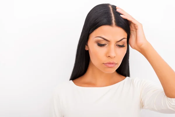 Depressed young woman touching her head — Stock Photo, Image