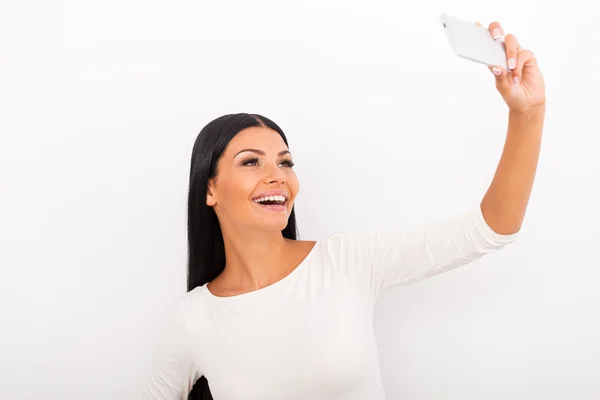 Woman making selfie on her smart phone — Stock Photo, Image