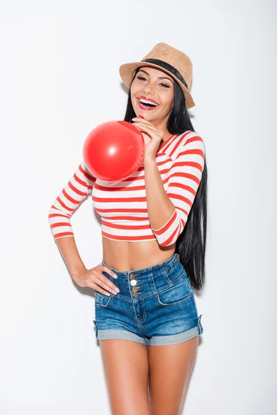 Woman holding red balloon — Stock Photo, Image