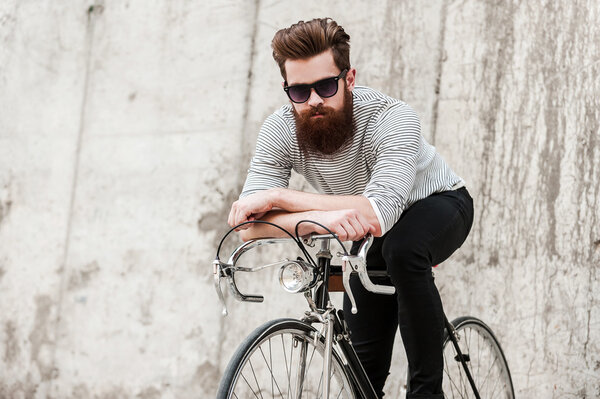 handsome bearded man with bicycle