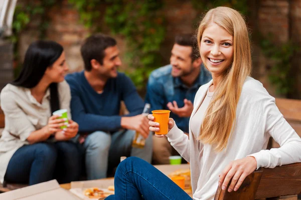 Woman holding glass  with  friends — Stock Photo, Image