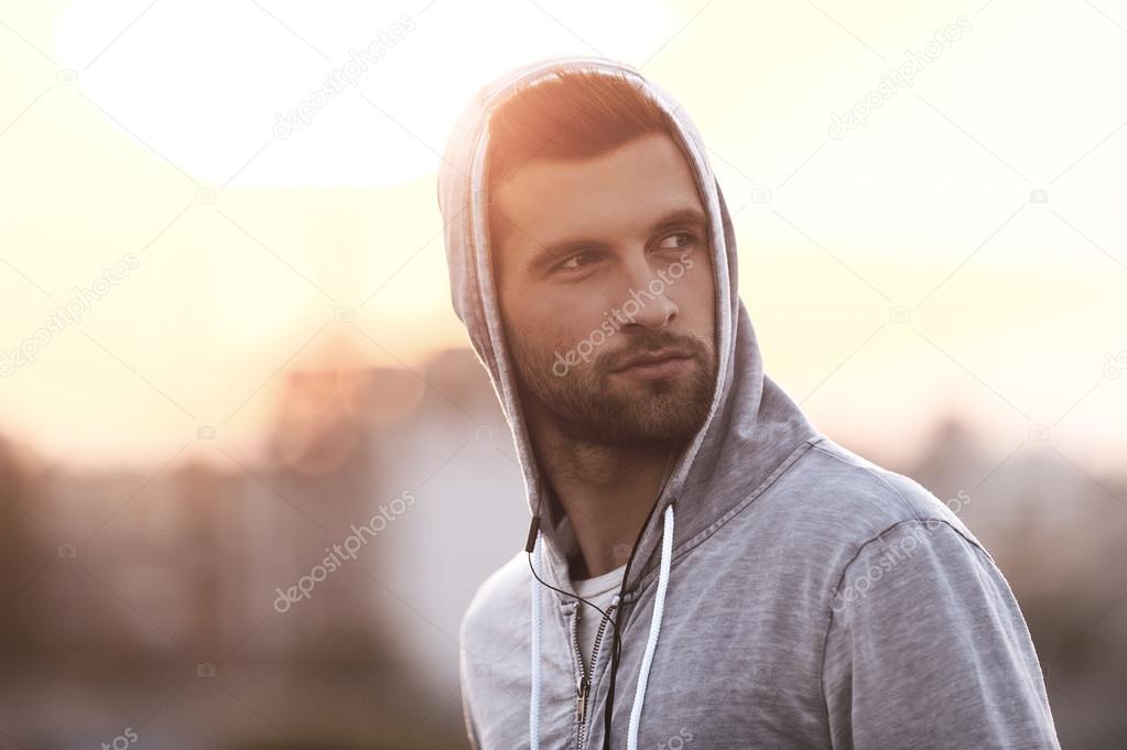Handsome young man wearing hood