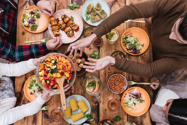people having dinner at the rustic table