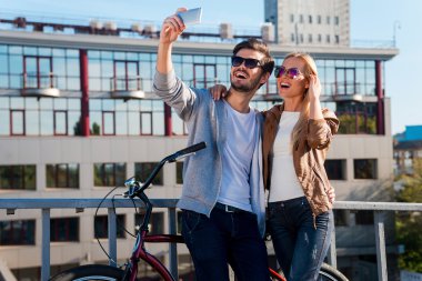 couple making selfie on their smart phone
