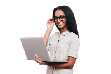 African woman holding laptop