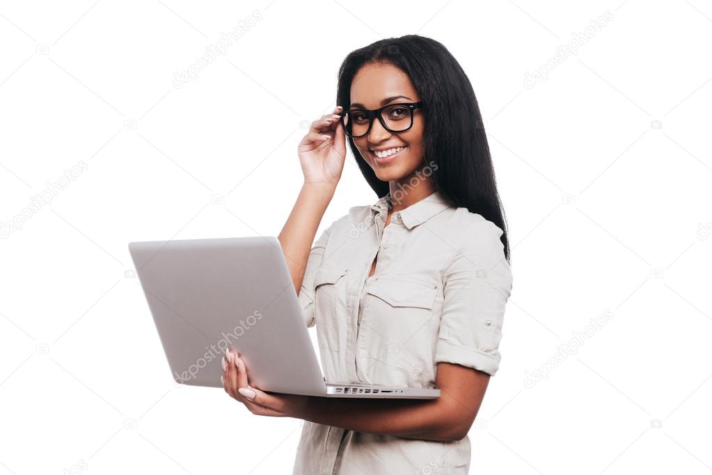 African woman holding laptop