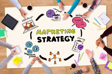 paper with marketing sketch and people around
