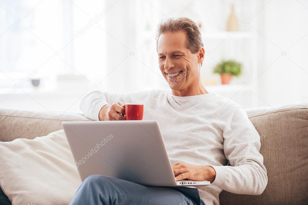 mature man working on laptop