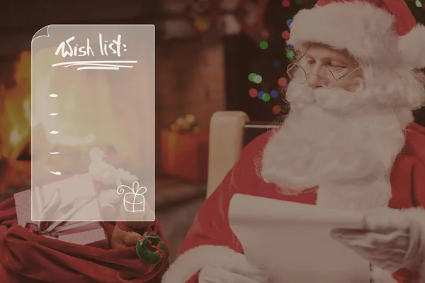 Papai Noel olhando para seu saco com presentes — Fotografia de Stock