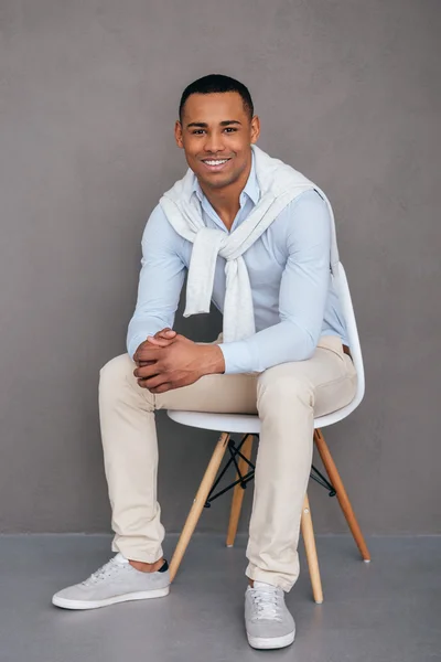 African man sitting on the chair — Stock Photo, Image