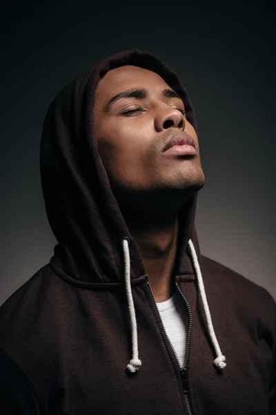 Confident young African man in hooded shirt — Stock Fotó