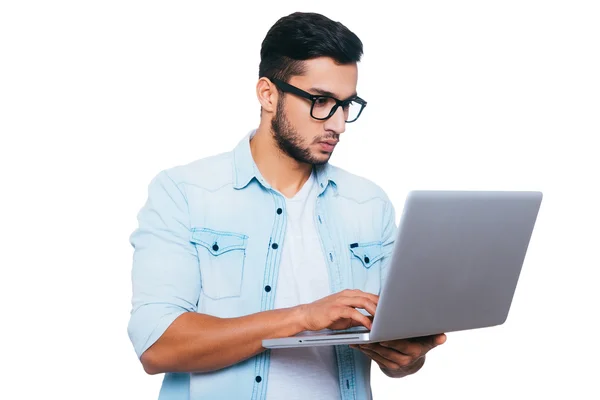 Indian man working on laptop — Stock Photo, Image