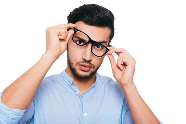 Frustrated man adjusting his eyeglasses — Stock fotografie