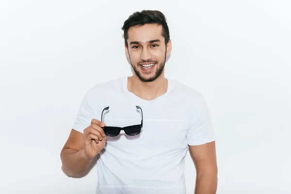 Indian man carrying sunglasses — Stock Fotó