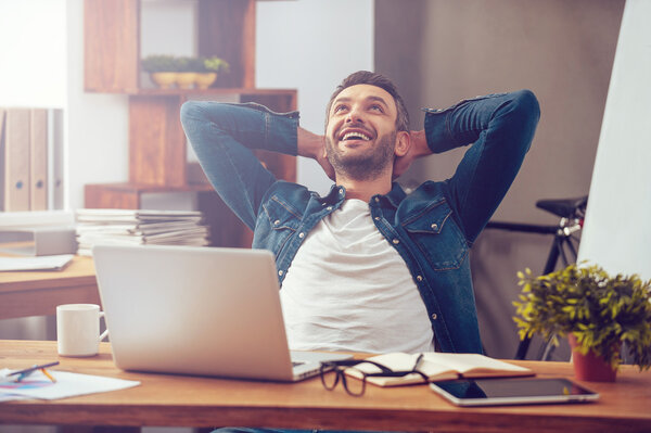 man working on laptop in office