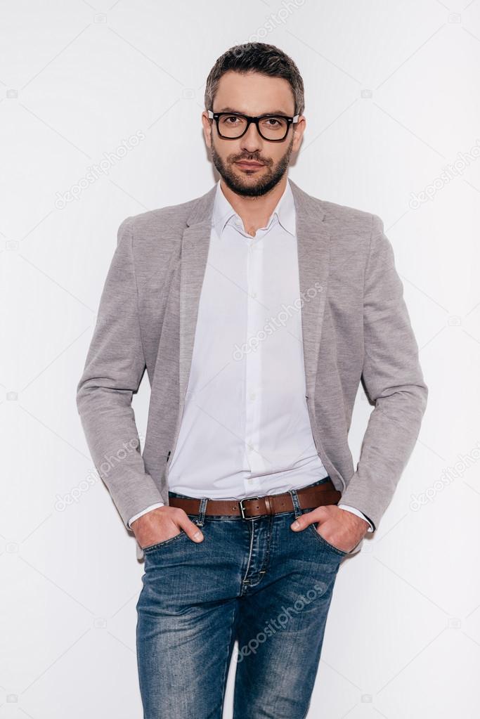 mature man holding hands in pockets