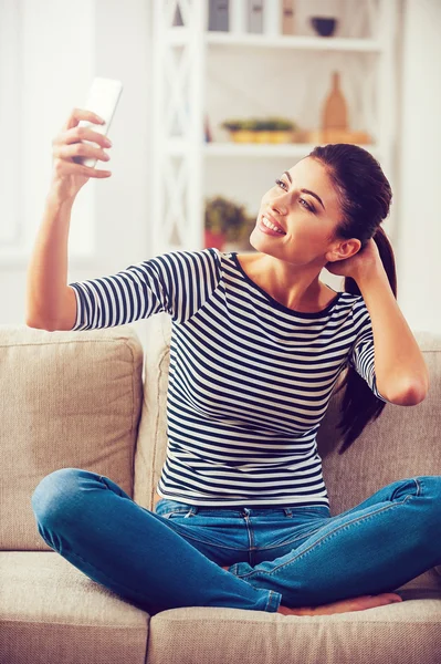 Woman making selfie by her smart phone — Stock Photo, Image