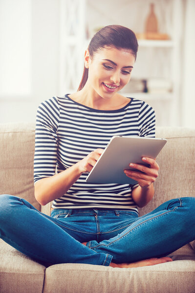 woman working on digital tablet