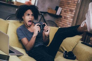 African man playing video game