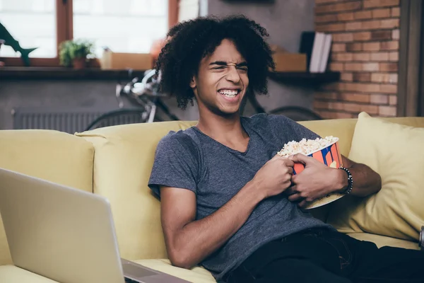 African man watching TV — Stok fotoğraf